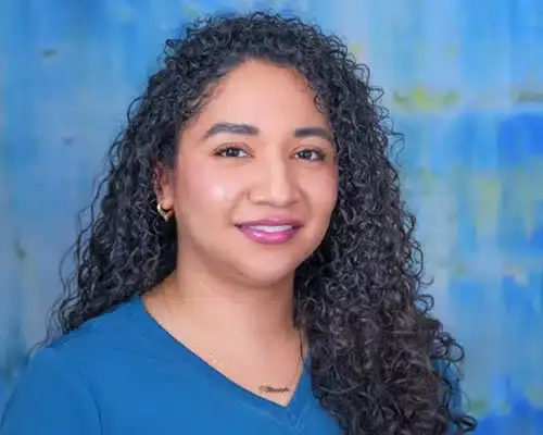 Female dental staff member smiling at Lake Ridge, VA dental practice.