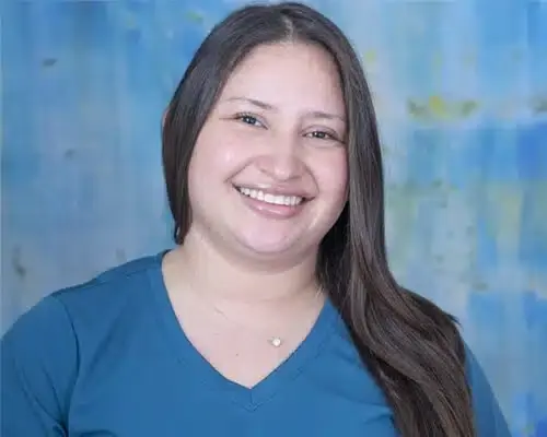 Female dental staff member smiling at Lake Ridge, VA dental practice.