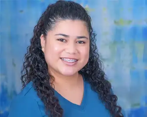 Female dental staff member smiling at Lake Ridge, VA dental practice.