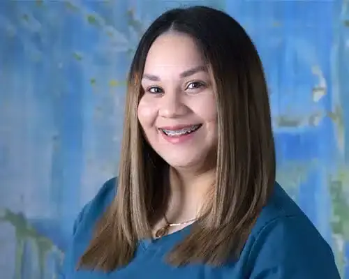 Female dental staff member smiling at Lake Ridge, VA practice.