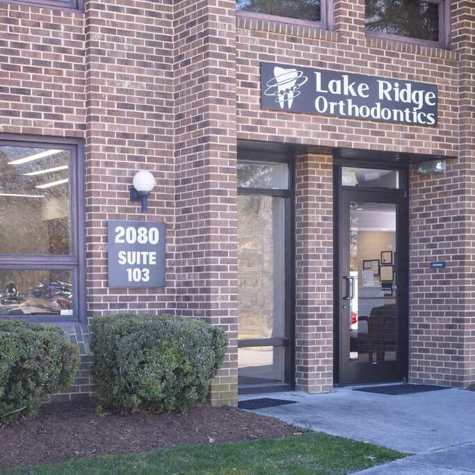 Lake Ridge Orthodontics storefront entrance with brick facade and signage at 2880 Ridge Road.